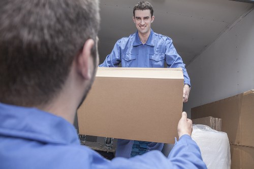 Man and van loading furniture in a Notting Hill street